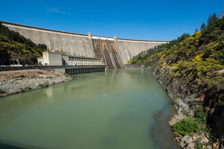 Photo of Shasta Dam with blue sky above